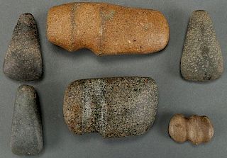 A GROUP OF SIX POLISHED STONE AX HEADS AND CELTS