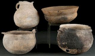 FOUR PIECES OF PREHISTORIC POTTERY