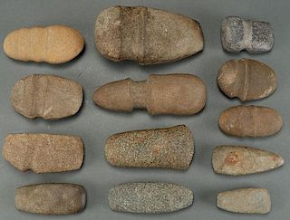 A LARGE GROUP OF 13 STONE AXES AND CELTS