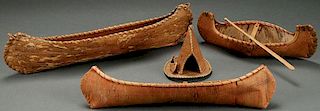 A GROUP OF THREE BIRCH BARK CANOES AND A TEEPEE