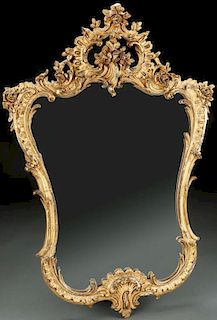 A LOUIS XVI STYLE CARVED AND GILTWOOD WALL MIRROR