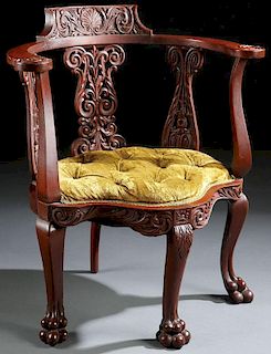 A VICTORIAN CARVED MAHOGANY ARM CHAIR