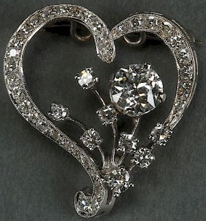 A VERY FINE WHITE GOLD AND DIAMOND “HEART”