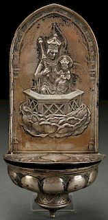 A FRENCH SILVERED METAL REPOUSSÉ HOLY WATER FONT