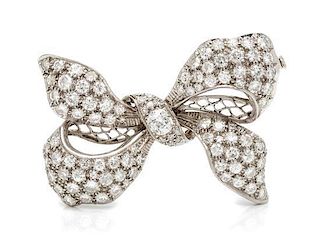 * A Platinum and Diamond Bow Brooch, 11.60 dwts.