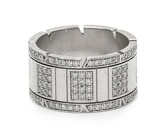An 18 Karat White Gold and Diamond 'Tank Francaise' Band Ring, Cartier, 12.30 dwts.