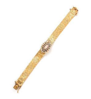 A 14 Karat Yellow Gold, Opal and Diamond Surprise Wristwatch, Luva, 26.40 dwts.