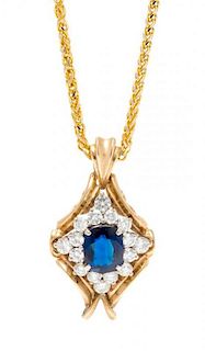 * A Bicolor Gold, Sapphire, and Diamond Pendant, 7.30 dwts.