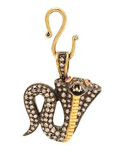 A Gilt Silver, Diamond and Ruby Serpent Pendant, 3.90 dwts.