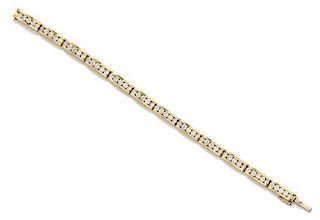 A Yellow Gold and Diamond Line Bracelet, 18.20 dwts.