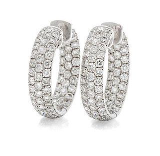 A Pair of 14 Karat White Gold and Diamond Hoop Earrings, 5.90 dwts.