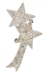 A White Gold and Diamond Shooting Star Brooch/Pendant, 5.50 dwts.