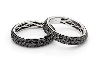 A Pair of 18 Karat White Gold and Black Diamond Rings, 4.30 dwts.