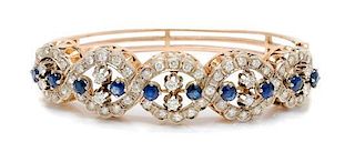 A 14 Karat Bicolor Gold, Sapphire and Diamond Bangle Bracelet, 22.90 dwts.