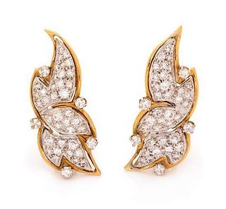 A Pair of Bicolor Gold and Diamond Earclips, 6.60 dwts.