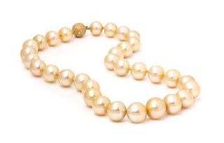 An 18 Karat Yellow Gold, Diamond and Graduated Cultured Golden South Sea Pearl Necklace,
