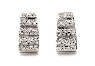 * A Pair of 14 Karat White Gold and Diamond Earclips, 9.00 dwts.