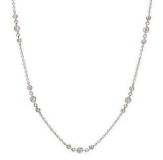 An 18 Karat White Gold and Diamond Station Necklace, 3.50 dwts.