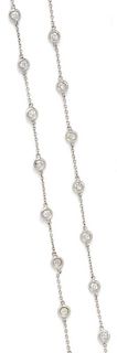 A 14 Karat White Gold and Diamond Station Necklace, 4.20 dwts.