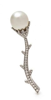 * An 18 Karat White Gold, Diamond and Cultured South Sea Pearl Flower Motif Brooch, RCM, 11.10 dwts.