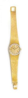 A 14 Karat Yellow Gold and Diamond Wristwatch, Omega, 26.40 dwts.