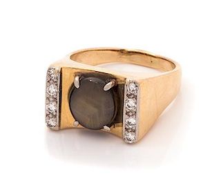 A 14 Karat Yellow Gold, Black Star Sapphire and Diamond Ring, 5.50 dwts.