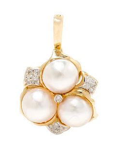 * A 14 Karat Yellow Gold, Mabe Pearl and Diamond Pendant, 4.80 dwts.