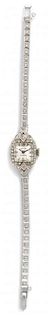 A 14 Karat White Gold and Diamond Wristwatch, Hilton, 9.80 dwts.