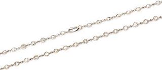 An 18 Karat White Gold and Diamond Station Necklace, 6.00 dwts.