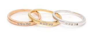 A Collection of 14 Karat Gold and Diamond Stacking Rings, 3.60 dwts.