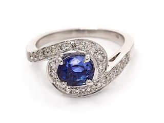 A 14 Karat White Gold, Sapphire and Diamond Ring, 3.30 dwts.