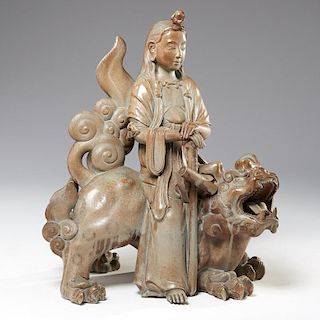 Large Asian stoneware Guanyin on Buddhist lion