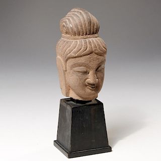 Carved sandstone bust of Buddha
