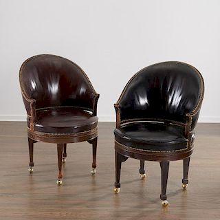 Near pair English leather barrel-back armchairs