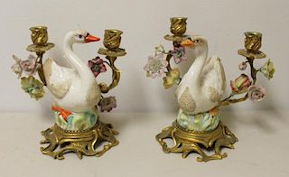 A Pair of Bronze and Porcelain Swan Form Candlebra