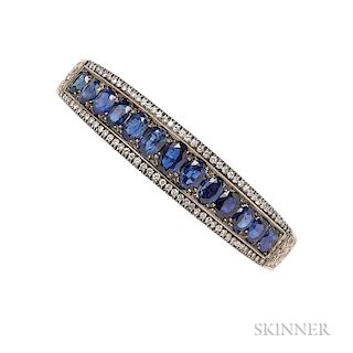 Gold, Sapphire, and Diamond Bracelet, the hinged bangle set with thirteen sapphires graduating in size, framed by full-cut di