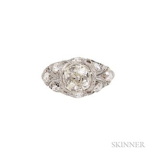 Art Deco Platinum and Diamond Ring, prong-set with an old mine cushion-cut diamond weighing approx. 1.25 cts., the shoulders 