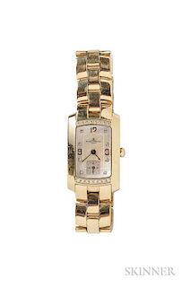 Lady's 18kt Gold and Diamond Wristwatch, Baume & Mercier, the mother-of-pearl dial with diamond and arabic numeral indicators