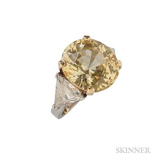 Yellow Sapphire and Diamond Ring, the circular-cut yellow sapphire weighing 16.66 cts., flanked by trillion-cut diamonds, app