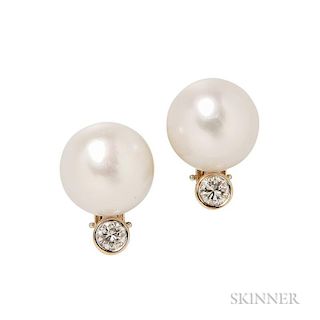 18kt Gold, South Sea Pearl, and Diamond Earclips, each set with a pearl measuring approx. 14.20 mm, bezel-set with a full-cut