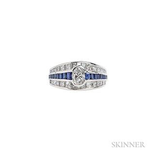Platinum, Diamond, and Sapphire Ring, J.B. Star, centering a bezel-set oval diamond, framed by channel-set sapphires and fanc