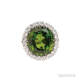 Fine Platinum, Peridot, and Diamond Ring, Suna Brothers, the round faceted peridot weighing 39.55 dwt, framed by twenty full-