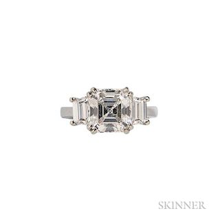 Platinum and Diamond Ring, centering a square emerald-cut diamond weighing 3.08 cts., flanked by trapezoid diamond baguettes,