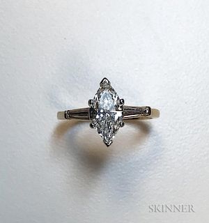Diamond Solitaire, centering a marquise-cut diamond weighing approx. 1.50 cts., flanked by tapering diamond baguettes, gold m