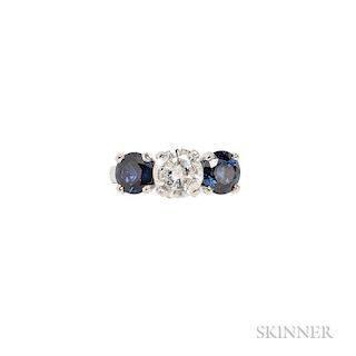 Platinum, Diamond, and Sapphire Ring, centering a round brilliant-cut diamond weighing 1.45 cts., flanked by circular-cut sap