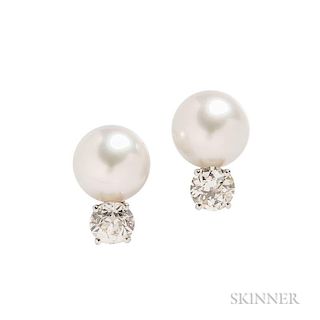 South Sea Pearl and Diamond Earrings, each set with an old European-cut diamond weighing approx. 1.65 and 1.70 cts., and a pe