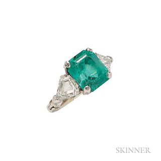 Platinum, Emerald, and Diamond Ring, the emerald-cut emerald measuring approx. 11.40 x 9.90 x 7.80 mm, flanked by shield-shap