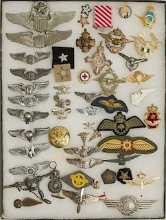 US Wings and Medals, incl. a Navy Cross planchet, along with a number of foreign Wings, Badges, and Medals