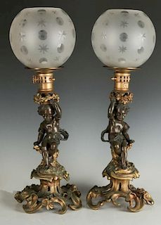 A PAIR 19TH C. FRENCH BRONZE PUTTO FIGURAL LAMPS