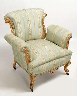 A FRENCH STYLE CARVED AND GILDED WOOD CHAIR W/SILK